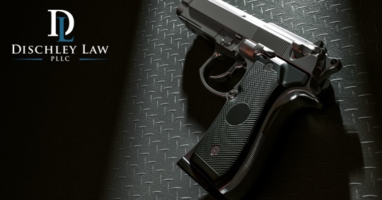 a gun against a black background