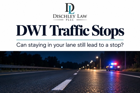 Dischley Law DWI traffic stops guide with a nighttime road and distant police lights